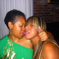 black girl kissing white girl